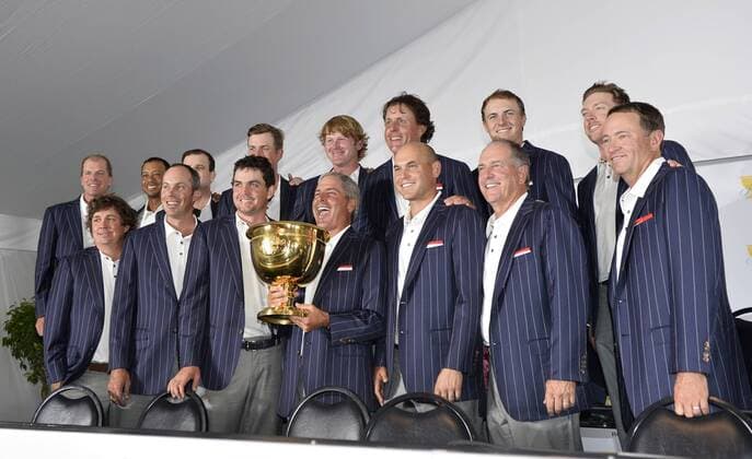 The US team L-R Steve Stricker, Jason Dufner, Tiger Woods, Matt Kuchar, Zach Johnson, Keegan Bradley, Webb Simpson, Cptn Fred Couples, Brandt Snedeker, Phil Mickelson, Bill Haas, Jordan Spieth, Jay Haas, Hunter Mahan and Davis Love III with the Presidents Cup at the 2013 PC at Muirfield Village Golf Club in Dublin, Ohio on October 6, 2013. BKX2013100628