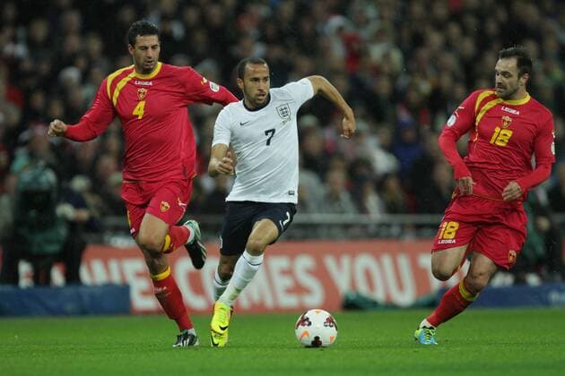 England v Montenegro - World Cup Qualifier . . Wembley, London, UK . . 11.10.2013 Milan Jovanovic (M) Andros Townsend (E) Nikola Drincic (M)