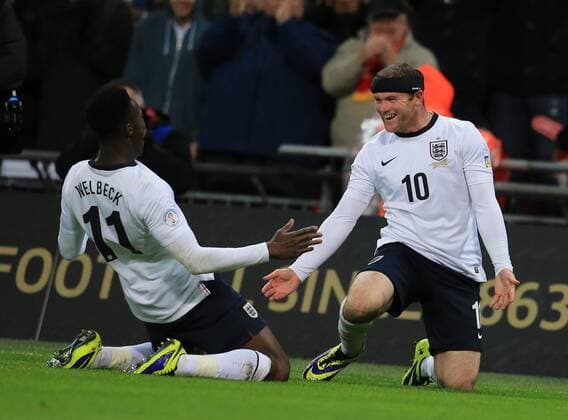 Wayne Rooney(R) and Daniel Welbedk of England celebrate scoring during the FIFA 2014 World Cup Qualifying match between England and Montenegro at Wembley Stadium in London, Britain on Oct. 11, 2013. England won 4-1.(Xinhua Yin Gang) (SP)BRITAIN-LONDON-SOCCER-FIFA 2014 WORLD CUP QUALIFIER-ENGLAND VS MONTENEGRO