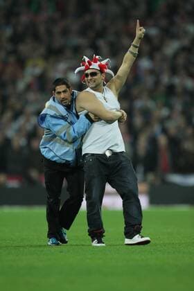 Poland - World Cup Qualifier . . Wembley, London . . 15.10.2013 A Poland fan enjoys himself on the pitch after invading.