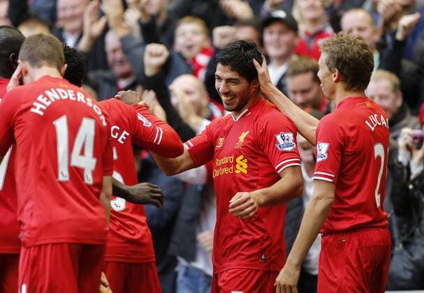 Liverpool s Luis Suarez celebrates scoring his third goal - Liverpool FC v West Bromwich Albion - Barclays Premier League - Anfield - Liverpool - England -26 10 2013 - EDITORIAL USE ONLY. No use with unauthorised audio, video, data, fixture lists, club league logos or live services. Online in-match use limited to 120 images, no video emulation. No use in betting, games or single club league player publications.
