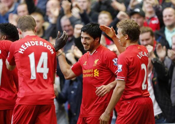 Liverpool s Luis Suarez celebrates scoring his third goal - Liverpool FC v West Bromwich Albion - Barclays Premier League - Anfield - Liverpool - England -26 10 2013 - EDITORIAL USE ONLY. No use with unauthorised audio, video, data, fixture lists, club league logos or live services. Online in-match use limited to 120 images, no video emulation. No use in betting, games or single club league player publications.