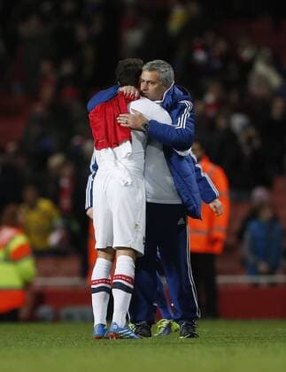 Chelsea manager Jose Mourinho hugs former player Arsenal s Mesut Ozil and takes his shirt Arsenal v Chelsea - Capital One Cup Fourth Round - The Emirates - London - England -29 10 2013 - Pic David Klein Sportimage EDITORIAL USE ONLY. No use with unauthorised audio, video, data, fixture lists, club league logos or live services. Online in-match use limited to 120 images, no video emulation. No use in betting, games or single club league player publications.