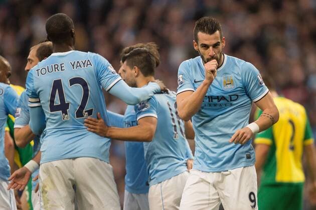 Alvaro Negredo of Manchester City celebrates scoring his sides fourth goal - Manchester City vs. Norwich City - Barclay s Premier League - Etihad Stadium - Manchester - 02 11 2013 Pic Philip Oldham Sportimage EDITORIAL USE ONLY. No use with unauthorised audio, video, data, fixture lists, club league logos or live services. Online in-match use limited to 120 images, no video emulation. No use in betting, games or single club league player publications.