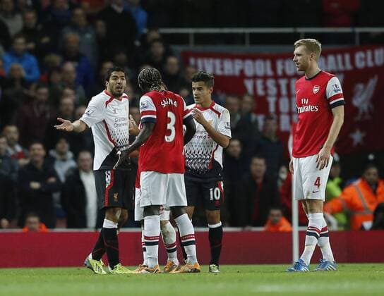 Liverpool s Luis Suarez has words with Arsenal s Bacary Sagna Arsenal v Liverpool - Barclays Premier League - Emirates Stadium - London - England -02 11 2013 - Pic David Klein Sportimage EDITORIAL USE ONLY. No use with unauthorised audio, video, data, fixture lists, club league logos or live services. Online in-match use limited to 120 images, no video emulation. No use in betting, games or single club league player publications.