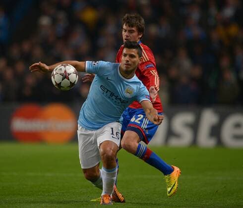 Sergio - Kun - Aguero of Manchester City tussles with Georgi Schennikov of CSKA Moscow - UEFA Champions League Group D - Manchester City vs CSKA Moscow - Etihad Stadium - Manchester - England - 05 11 13 - EDITORIAL USE ONLY. No use with unauthorised audio, video, data, fixture lists, club league logos or live services. Online in-match use limited to 120 images, no video emulation. No use in betting, games or single club league player publications.
