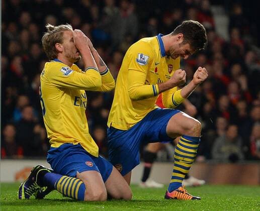 Nicklas Bendtner and Olivier Giroud of Arsenal react to a last minute chance to equalise - Barclays Premier League - Manchester United (ManU) vs Arsenal FC London - Old Trafford Stadium - Manchester - England - 10 11 13 - EDITORIAL USE ONLY. No use with unauthorised audio, video, data, fixture lists, club league logos or live services. Online in-match use limited to 120 images, no video emulation. No use in betting, games or single club league player publications.