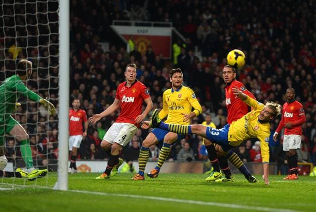 Nicklas Bendtner and Olivier Giroud of Arsenal with a last minute chance to equalise - Barclays Premier League - Manchester United (ManU) vs Arsenal FC London - Old Trafford Stadium - Manchester - England - 10 11 13 - EDITORIAL USE ONLY. No use with unauthorised audio, video, data, fixture lists, club league logos or live services. Online in-match use limited to 120 images, no video emulation. No use in betting, games or single club league player publications.