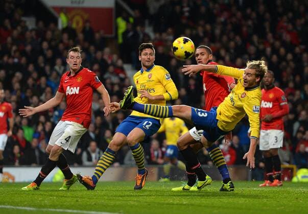 Nicklas Bendtner and Olivier Giroud of Arsenal with a last minute chance to equalise - Barclays Premier League - Manchester United (ManU) vs Arsenal FC London - Old Trafford Stadium - Manchester - England - 10 11 13 - EDITORIAL USE ONLY. No use with unauthorised audio, video, data, fixture lists, club league logos or live services. Online in-match use limited to 120 images, no video emulation. No use in betting, games or single club league player publications.