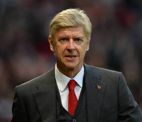 Arsene Wenger manager of Arsenal - Barclays Premier League - Manchester United (ManU) vs Arsenal FC London - Old Trafford Stadium - Manchester - England - 10 11 13 - EDITORIAL USE ONLY. No use with unauthorised audio, video, data, fixture lists, club league logos or live services. Online in-match use limited to 120 images, no video emulation. No use in betting, games or single club league player publications.