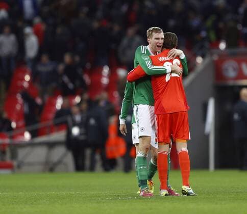 Germany s Per Mertesacker celebrates at the final whistle with goalkeeper Roman Weidenfeller England v Germany - International Friendly - Wembley England -19 11 2013 - Pic David Klein Sportimage EDITORIAL USE ONLY. No use with unauthorised audio, video, data, fixture lists, club league logos or live services. Online in-match use limited to 120 images, no video emulation. No use in betting, games or single club league player publications.