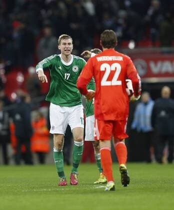Germany s Per Mertesacker celebrates at the final whistle with goalkeeper Roman Weidenfeller England v Germany - International Friendly - Wembley England -19 11 2013 - Pic David Klein Sportimage EDITORIAL USE ONLY. No use with unauthorised audio, video, data, fixture lists, club league logos or live services. Online in-match use limited to 120 images, no video emulation. No use in betting, games or single club league player publications.