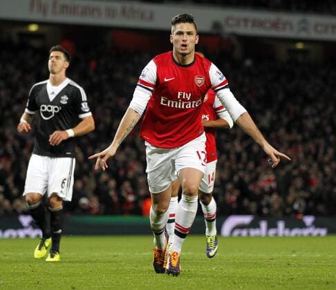Olivier Giroud of Arsenal celebrates scoring his second goal during the Barclays Premier League match between Arsenal and Southampton at Emirates Stadium in London, Britain on Nov. 23, 2013. Arsenal won 2-0. (Xinhua Wang Lili) FOR EDITORIAL USE ONLY. NOT FOR SALE FOR MARKETING OR ADVERTISING CAMPAIGNS. NO USE WITH UNAUTHORIZED AUDIO, VIDEO, DATA, FIXTURE LISTS, CLUB LEAGUE LOGOS OR LIVE SERVICES. ONLINE IN-MATCH USE LIMITED TO 45 IMAGES, NO VIDEO EMULATION. NO USE IN BETTING, GAMES OR SINGLE CLUB LEAGUE PLAYER PUBLICATIONS. (SP)BRITAIN-LONDON-SOCCER-PREMIER LEAGUE-ARSENAL VS SOUTHAMPTON