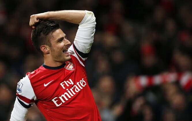 Olivier Giroud of Arsenal celebrates scoring his second goal during the Barclays Premier League match between Arsenal and Southampton at Emirates Stadium in London, Britain on Nov. 23, 2013. Arsenal won 2-0. (Xinhua Wang Lili) FOR EDITORIAL USE ONLY. NOT FOR SALE FOR MARKETING OR ADVERTISING CAMPAIGNS. NO USE WITH UNAUTHORIZED AUDIO, VIDEO, DATA, FIXTURE LISTS, CLUB LEAGUE LOGOS OR LIVE SERVICES. ONLINE IN-MATCH USE LIMITED TO 45 IMAGES, NO VIDEO EMULATION. NO USE IN BETTING, GAMES OR SINGLE CLUB LEAGUE PLAYER PUBLICATIONS. (SP)BRITAIN-LONDON-SOCCER-PREMIER LEAGUE-ARSENAL VS SOUTHAMPTON