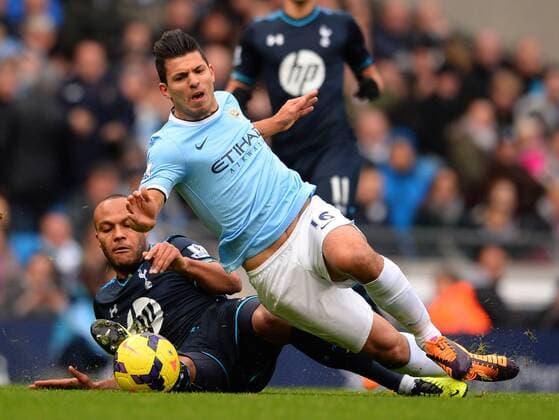 Younes Kaboul of Tottenham challenges Sergio Kun Agüero of Manchester City - Barclays Premier League - Manchester City vs Tottenham Hotspur - Etihad Stadium - Manchester - England - 24th November 2013 - EDITORIAL USE ONLY. No use with unauthorised audio, video, data, fixture lists, club league logos or live services. Online in-match use limited to 120 images, no video emulation. No use in betting, games or single club league player publications.
