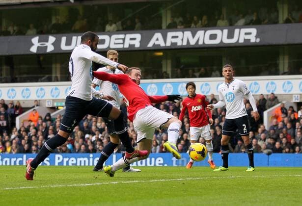 Manchester United s Wayne Rooney scoring his sides opening goal Tottenham Hotspur v Manchester United (ManU) - Premier League - White Hart Lane - London - 01 12 2013 - EDITORIAL USE ONLY. No use with unauthorised audio, video, data, fixture lists, club league logos or live services. Online in-match use limited to 120 images, no video emulation. No use in betting, games or single club league player publications.