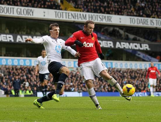 Tottenham s Vlad Chiriches tussles with Manchester United s Wayne Rooney Tottenham Hotspur v Manchester United - Premier League - White Hart Lane - London - 01 12 2013 - Pic David Klein Sportimage EDITORIAL USE ONLY. No use with unauthorised audio, video, data, fixture lists, club league logos or live services. Online in-match use limited to 120 images, no video emulation. No use in betting, games or single club league player publications.