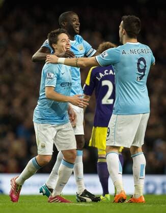 Sergio Kun Aguero of Manchester City celebrates his goal with Yaya Toure and Alvaro Negredo - Manchester City vs. Swansea City - Barclays Premier League - Etihad Stadium - Manchester - 01 12 2013 Pic Philip Oldham Sportimage EDITORIAL USE ONLY. No use with unauthorised audio, video, data, fixture lists, club league logos or live services. Online in-match use limited to 120 images, no video emulation. No use in betting, games or single club league player publications.