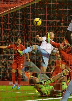 James Collins of West Ham United turns the ball into his own net for the second goal - Barclays Premier League - Liverpool vs West Ham Utd - Anfield Stadium - Liverpool - England - 7th December 2013 - Picture Simon Bellis Sportimage EDITORIAL USE ONLY. No use with unauthorised audio, video, data, fixture lists, club league logos or live services. Online in-match use limited to 120 images, no video emulation. No use in betting, games or single club league player publications.