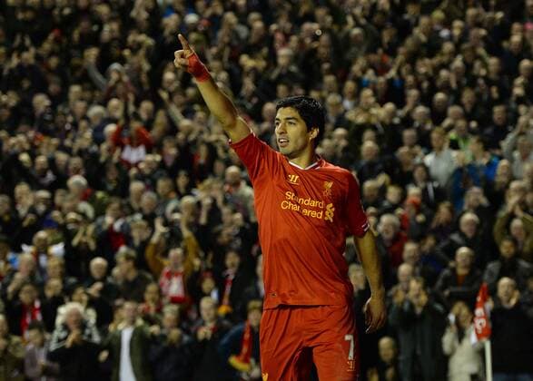 Luis Suarez of Liverpool celebrates the third goal - Barclays Premier League - Liverpool vs West Ham Utd - Anfield Stadium - Liverpool - England - 7th December 2013 - Picture Simon Bellis Sportimage EDITORIAL USE ONLY. No use with unauthorised audio, video, data, fixture lists, club league logos or live services. Online in-match use limited to 120 images, no video emulation. No use in betting, games or single club league player publications.