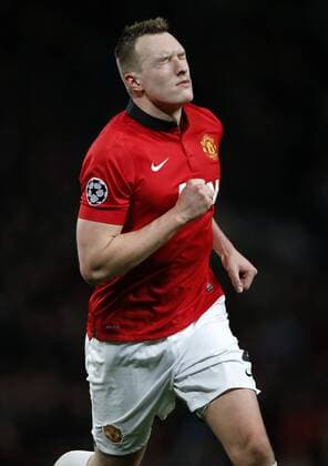 Phil Jones of Manchester United celebrates scoring during the UEFA Champions League Group A match between Manchester United and Shakhtar Donetsk at Old Trafford Stadium in Manchester, Britain on Dec. 10, 2013. Manchester United won 1-0. (Xinhua Wang Lili) (SP)BRITAIN-MANCHESTER-SOCCER-UEFA CHAMPIONS LEAGUE-GROUP A-MAN UTD VS DONETSK