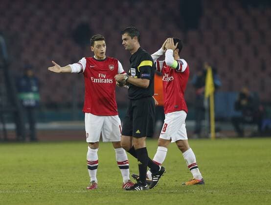Arsenal s Mesut Ozil looks on dejected as Mikel Arteta gets sent off Napoli v Arsenal - UEFA Champions League - San Paolo Stadium - Naples - Italy - 11 12 2013 - Pic David Klein Sportimage EDITORIAL USE ONLY. No use with unauthorised audio, video, data, fixture lists, club league logos or live services. Online in-match use limited to 120 images, no video emulation. No use in betting, games or single club league player publications.