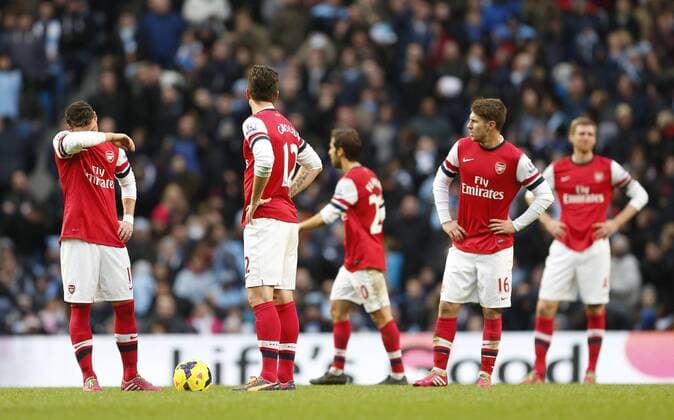 Arsenal s Mesut Ozil and Olivier Giroud look on dejected after going 5-2 down Manchester City vs Arsenal - Premier League - Etihad Stadium - Manchester - England - 14 12 2013 - Pic David Klein Sportimage EDITORIAL USE ONLY. No use with unauthorised audio, video, data, fixture lists, club league logos or live services. Online in-match use limited to 120 images, no video emulation. No use in betting, games or single club league player publications.