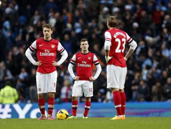 Arsenal s Jack Wilshere looks on dejected after going 6-3 down Manchester City vs Arsenal - Premier League - Etihad Stadium - Manchester - England - 14 12 2013 - Pic David Klein Sportimage EDITORIAL USE ONLY. No use with unauthorised audio, video, data, fixture lists, club league logos or live services. Online in-match use limited to 120 images, no video emulation. No use in betting, games or single club league player publications.