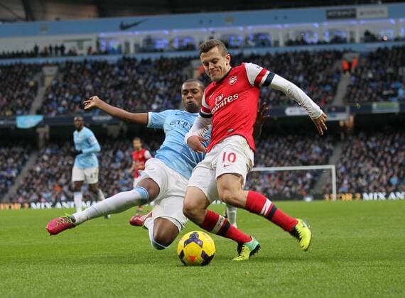 Manchester City s Fernandinho tussles with Arsenal s Jack Wilshere Manchester City vs Arsenal - Premier League - Etihad Stadium - Manchester - England - 14 12 2013 - Pic David Klein Sportimage EDITORIAL USE ONLY. No use with unauthorised audio, video, data, fixture lists, club league logos or live services. Online in-match use limited to 120 images, no video emulation. No use in betting, games or single club league player publications.