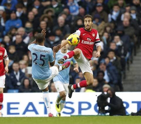 Manchester City s Fernandinho tussleswith Arsenal s Mathieu Flamini Manchester City vs Arsenal - Premier League - Etihad Stadium - Manchester - England - 14 12 2013 - EDITORIAL USE ONLY. No use with unauthorised audio, video, data, fixture lists, club league logos or live services. Online in-match use limited to 120 images, no video emulation. No use in betting, games or single club league player publications.