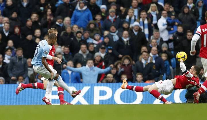 Manchester City s Fernandinho scoring his sides third goal Manchester City vs Arsenal - Premier League - Etihad Stadium - Manchester - England - 14 12 2013 - EDITORIAL USE ONLY. No use with unauthorised audio, video, data, fixture lists, club league logos or live services. Online in-match use limited to 120 images, no video emulation. No use in betting, games or single club league player publications.