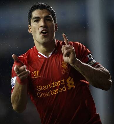 Luis Suarez of Liverpool celebrates scoring their fourth goal during the Barclays Premier League match between Tottenham Hotspur and Liverpool at White Hart Lane in London, Britain on Dec. 15, 2013. Liverpool won 5-0. (Xinhua Wang Lili) FOR EDITORIAL USE ONLY. NOT FOR SALE FOR MARKETING OR ADVERTISING CAMPAIGNS. NO USE WITH UNAUTHORIZED AUDIO, VIDEO, DATA, FIXTURE LISTS, CLUB LEAGUE LOGOS OR LIVE SERVICES. ONLINE IN-MATCH USE LIMITED TO 45 IMAGES, NO VIDEO EMULATION. NO USE IN BETTING, GAMES OR SINGLE CLUB LEAGUE PLAYER PUBLICATIONS. (SP)BRITAIN-LONDON-SOCCER-PREMIER LEAGUE-TOTTENHAM HOTSPUR VS LIVERPOOL