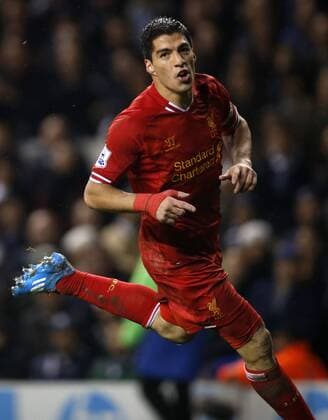 Luis Suarez of Liverpool celebrates scoring their fourth goal during the Barclays Premier League match between Tottenham Hotspur and Liverpool at White Hart Lane in London, Britain on Dec. 15, 2013. Liverpool won 5-0. (Xinhua Wang Lili) FOR EDITORIAL USE ONLY. NOT FOR SALE FOR MARKETING OR ADVERTISING CAMPAIGNS. NO USE WITH UNAUTHORIZED AUDIO, VIDEO, DATA, FIXTURE LISTS, CLUB LEAGUE LOGOS OR LIVE SERVICES. ONLINE IN-MATCH USE LIMITED TO 45 IMAGES, NO VIDEO EMULATION. NO USE IN BETTING, GAMES OR SINGLE CLUB LEAGUE PLAYER PUBLICATIONS. (SP)BRITAIN-LONDON-SOCCER-PREMIER LEAGUE-TOTTENHAM HOTSPUR VS LIVERPOOL