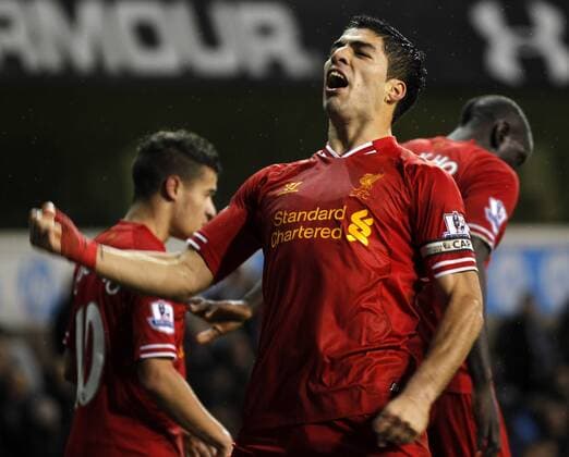 Luis Suarez of Liverpool celebrates scoring their fourth goal during the Barclays Premier League match between Tottenham Hotspur and Liverpool at White Hart Lane in London, Britain on Dec. 15, 2013. Liverpool won 5-0. (Xinhua Wang Lili) FOR EDITORIAL USE ONLY. NOT FOR SALE FOR MARKETING OR ADVERTISING CAMPAIGNS. NO USE WITH UNAUTHORIZED AUDIO, VIDEO, DATA, FIXTURE LISTS, CLUB LEAGUE LOGOS OR LIVE SERVICES. ONLINE IN-MATCH USE LIMITED TO 45 IMAGES, NO VIDEO EMULATION. NO USE IN BETTING, GAMES OR SINGLE CLUB LEAGUE PLAYER PUBLICATIONS. (SP)BRITAIN-LONDON-SOCCER-PREMIER LEAGUE-TOTTENHAM HOTSPUR VS LIVERPOOL