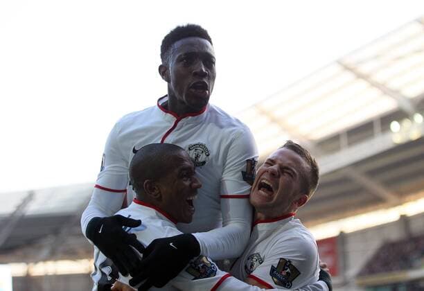 Manchester United s Tom Cleverley, Ashley Young, and Danny Welbeck celebrate their sides third goal Hull City vs Manchester United - Premier League - KC Stadium - London - England - 26 12 2013 - Pic David Klein Sportimage EDITORIAL USE ONLY. No use with unauthorised audio, video, data, fixture lists, club league logos or live services. Online in-match use limited to 120 images, no video emulation. No use in betting, games or single club league player publications.