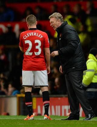 David Moyes manager of Manchester United talks to Tom Cleverley of Manchester United - Barclays Premier League - Manchester Utd vs Tottenham - Old Trafford Stadium - Manchester - England - 1st January 2014 - Picture Simon Bellis Sportimage EDITORIAL USE ONLY. No use with unauthorised audio, video, data, fixture lists, club league logos or live services. Online in-match use limited to 120 images, no video emulation. No use in betting, games or single club league player publications.