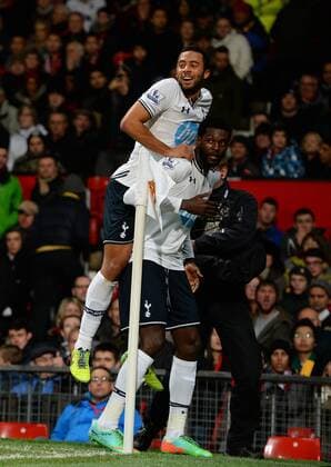 Emmanuel Adebayor of Tottenham celebrates his goal with Mousa Dembele of Tottenham - Barclays Premier League - Manchester Utd vs Tottenham - Old Trafford Stadium - Manchester - England - 1st January 2014 - Picture Simon Bellis Sportimage EDITORIAL USE ONLY. No use with unauthorised audio, video, data, fixture lists, club league logos or live services. Online in-match use limited to 120 images, no video emulation. No use in betting, games or single club league player publications.