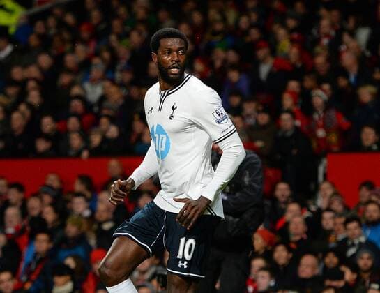 Emmanuel Adebayor of Tottenham celebrates scoring with a header - Barclays Premier League - Manchester Utd vs Tottenham - Old Trafford Stadium - Manchester - England - 1st January 2014 - Picture Simon Bellis Sportimage EDITORIAL USE ONLY. No use with unauthorised audio, video, data, fixture lists, club league logos or live services. Online in-match use limited to 120 images, no video emulation. No use in betting, games or single club league player publications.