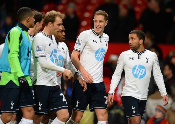 Tottenham players walk off happy at the end - Barclays Premier League - Manchester Utd vs Tottenham - Old Trafford Stadium - Manchester - England - 1st January 2014 - Picture Simon Bellis Sportimage EDITORIAL USE ONLY. No use with unauthorised audio, video, data, fixture lists, club league logos or live services. Online in-match use limited to 120 images, no video emulation. No use in betting, games or single club league player publications.