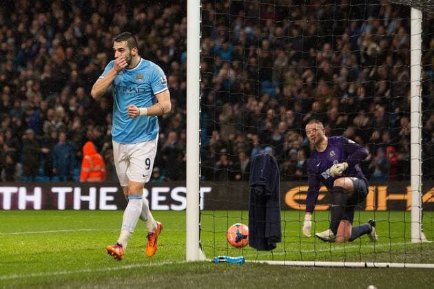 Alvaro Negredo of Manchester City celebrates his opening goal - Manchester City vs. Blackburn Rovers - FA Cup Third Round Replay - Etihad Stadium - Manchester - 15 01 2014 Pic Philip Oldham Sportimage EDITORIAL USE ONLY. No use with unauthorised audio, video, data, fixture lists, club league logos or live services. Online in-match use limited to 120 images, no video emulation. No use in betting, games or single club league player publications.