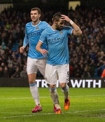 Alvaro Negredo of Manchester City celebrates his opening goal - Manchester City vs. Blackburn Rovers - FA Cup Third Round Replay - Etihad Stadium - Manchester - 15 01 2014 Pic Philip Oldham Sportimage EDITORIAL USE ONLY. No use with unauthorised audio, video, data, fixture lists, club league logos or live services. Online in-match use limited to 120 images, no video emulation. No use in betting, games or single club league player publications.