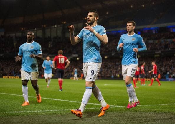 Alvaro Negredo of Manchester City celebrates his opening goal - Manchester City vs. Blackburn Rovers - FA Cup Third Round Replay - Etihad Stadium - Manchester - 15 01 2014 Pic Philip Oldham Sportimage EDITORIAL USE ONLY. No use with unauthorised audio, video, data, fixture lists, club league logos or live services. Online in-match use limited to 120 images, no video emulation. No use in betting, games or single club league player publications.