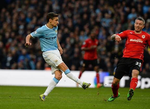 Jesus Navas of Manchester City scores the second goal - Barclays Premier League - Manchester City vs Cardiff City - Etihad Stadium - Manchester - England - 18th January 2014 - Picture SimonBellis Sportimage EDITORIAL USE ONLY. No use with unauthorised audio, video, data, fixture lists, club league logos or live services. Online in-match use limited to 120 images, no video emulation. No use in betting, games or single club league player publications.