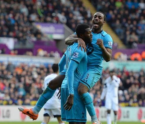 Emmanuel Adebayor of Tottenham celebrates the third goal with Danny Rose of Tottenham - Barclays Premier League - Swansea City vs Tottenham Hotspur - Liberty Stadium - Swansea - Wales - 19th January 2014 - EDITORIAL USE ONLY. No use with unauthorised audio, video, data, fixture lists, club league logos or live services. Online in-match use limited to 120 images, no video emulation. No use in betting, games or single club league player publications.