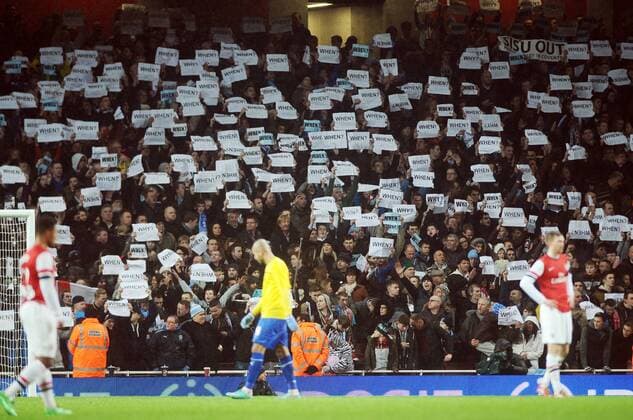 Football - 2013 2014 FA Cup - Fourth Round: Arsenal vs. Coventry City Coventry fans hold up their Protest cards at The Emirates. COLORSPORT ANDREW COWIE