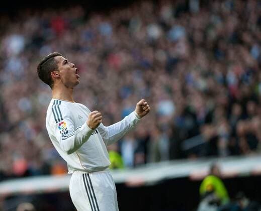 Real Madrid s Cristiano Ronaldo celebrates his goal during the Spanish first division soccer match against Granada in Madrid Jan. 25, 2014. Real Madrid won the match 2-0. (Xinhua Xie Haining) (SP)SPAIN-MADRID-SOCCER-SPANISH FIRST DIVISION