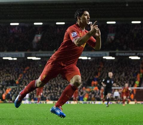 Luis Suarez of Liverpool celebrates scoring his sides fourth goal - Liverpool FC vs. Everton FC - Barclays Premier League - Anfield - Liverpool - 28 01 2014 EDITORIAL USE ONLY. No use with unauthorised audio, video, data, fixture lists, club league logos or live services. Online in-match use limited to 120 images, no video emulation. No use in betting, games or single club league player publications.