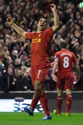 Luis Suarez of Liverpool celebrates scoring his sides fourth goal - Liverpool FC vs. Everton FC - Barclays Premier League - Anfield - Liverpool - 28 01 2014 EDITORIAL USE ONLY. No use with unauthorised audio, video, data, fixture lists, club league logos or live services. Online in-match use limited to 120 images, no video emulation. No use in betting, games or single club league player publications.