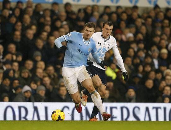 Tottenham s Vlad Chiriches tussles with Manchester City s Edin Dzeko Tottenham vs Manchester City - Barclays Premier League - White Hart Lane - London - England - 29 01 2014 - Pic DavidKlein Sportimage EDITORIAL USE ONLY. No use with unauthorised audio, video, data, fixture lists, club league logos or live services. Online in-match use limited to 120 images, no video emulation. No use in betting, games or single club league player publications.