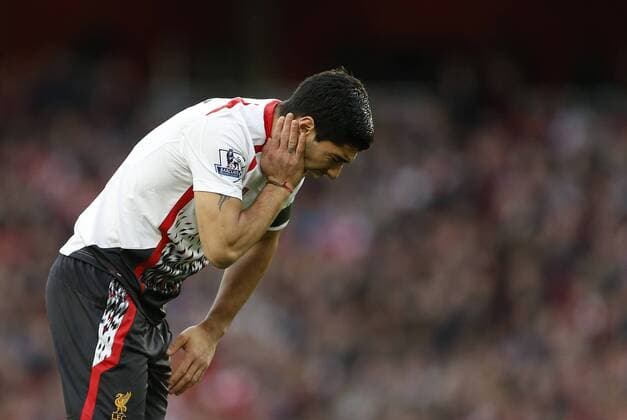 Liverpool s Luis Suarez looks on dejected Arsenal vs Liverpool - FA Cup Fifth Round - Emirates Stadium - London - England - 16 02 2014 - EDITORIAL USE ONLY. No use with unauthorised audio, video, data, fixture lists, club league logos or live services. Online in-match use limited to 120 images, no video emulation. No use in betting, games or single club league player publications.